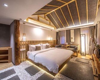 Lijiang Muqian Hotel - Lijiang - Bedroom