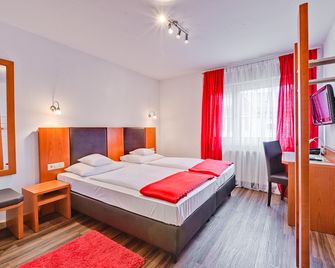 هوتل آم فريدين سبلاتس - شتوتغارت - غرفة نوم