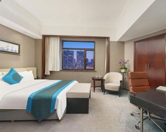 Lee Wan Hotel - דאליין - חדר שינה