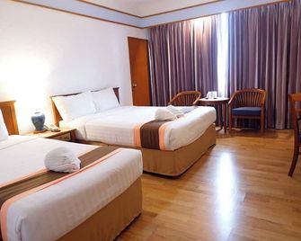 Diamond Plaza Hotel Suratthani - סוראט תאני - חדר שינה