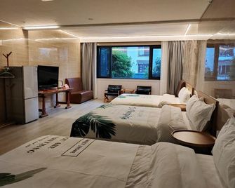 Rockabond Family Inn - Guilin - Sypialnia