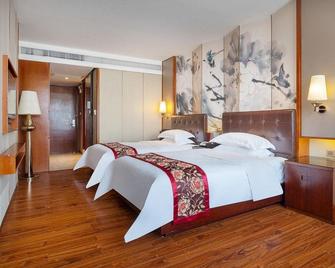 Yangjiang Minghao Hotel - Yangjiang - Спальня
