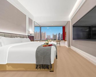 Dalian Northstar Ancient City Starry Sky · Eaton Hotel - Dalian - Schlafzimmer