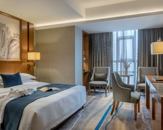Yannian Huijing Hotel - צ'נגשה - חדר שינה