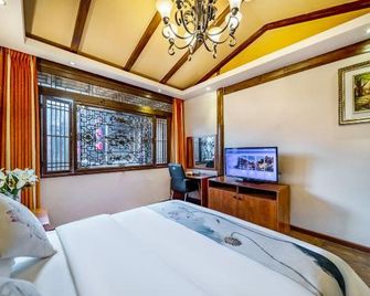 Jifeng Zhilv Inn - Lijiang - Bedroom