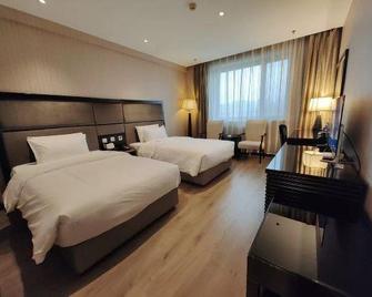 Jinlin Oriental Hotel - Taiyuan - Schlafzimmer