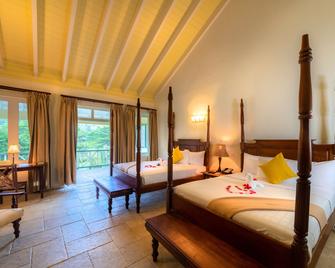 Rosalie Bay Eco Resort & Spa - רוזו - חדר שינה