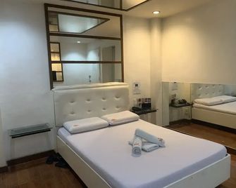 Town And Country Reposo - מנילה - חדר שינה