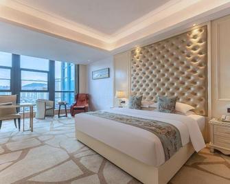 Tongren Zhusha Grand Hotel Fanjingshan Avenue Branch - Tongren - Bedroom