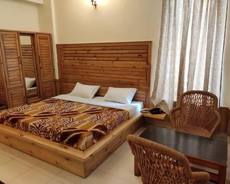 Greenwoods Inn - Dharamshala - Phòng ngủ