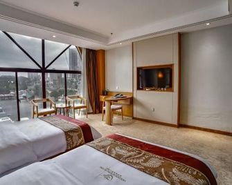 Golden Apple Hot Spring Hotel - Ан-Шун - Спальня