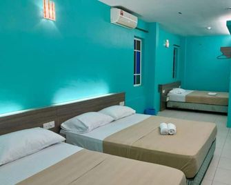 Qish Hotel - Malakka - Schlafzimmer