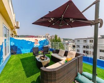 Yuehai Huan Ting Homestay - Dalian - Balcon
