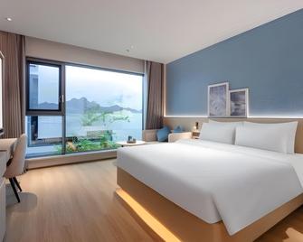 Country Inn & Suite by Radisson, Chongqing Liberation Monument Hongya Cave - ฉงชิ่ง - ห้องนอน