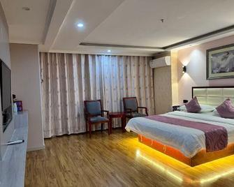Changningyuan Hotel - Changji - Bedroom