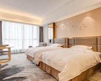 Li Cai Tian Qi Hotel Xianyang - Xianyang - Bedroom