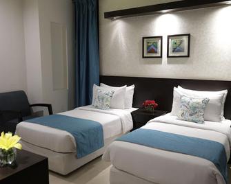 Hotel Rockland Panchsheel Enclave - นิวเดลี - ห้องนอน
