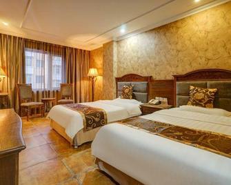 Wansheng Hotel (Harbin Central Street) - Harbin - Bedroom