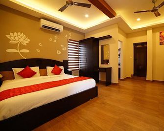Metro Residency - Ernakulam - Schlafzimmer