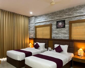 hotel floral palace - Kottayam - Ložnice