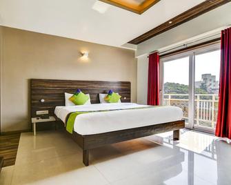 Treebo Shree Sai Suites - Kolhapur - Slaapkamer
