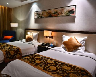 Huayang Holiday Hotel - Shijiazhuang - Schlafzimmer