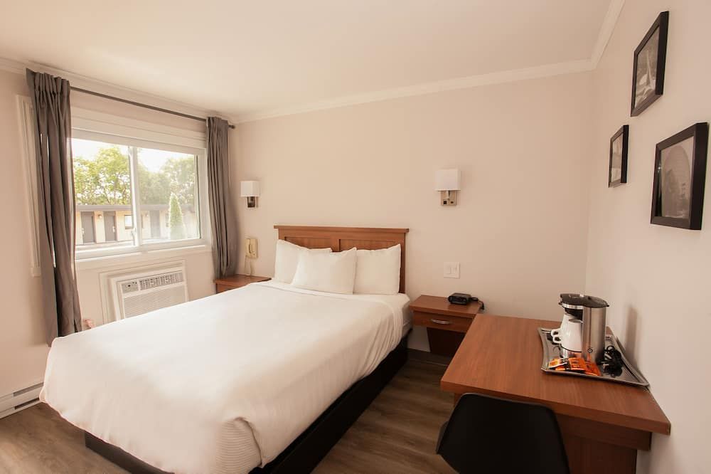 Motel Newstar Laval - Лаваль - Спальня