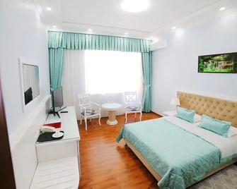 Bravo Lyuks Hotel - Urgench - Bedroom