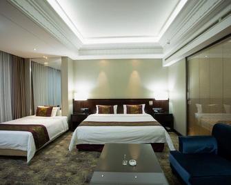 Xinyu Baoli Hotel - Panjin - Slaapkamer
