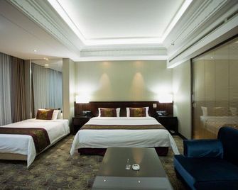 Xinyu Baoli Hotel - Panjin - Bedroom