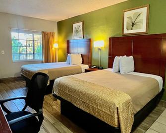 Travelodge Suites by Wyndham Lake Okeechobee - Okeechobee - Schlafzimmer
