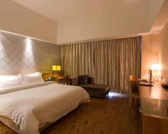 Metropolo Ningde Wanda Plaza Hotel - Ningde - Bedroom