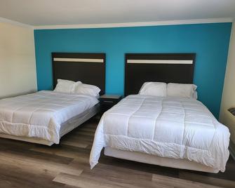 Budget Inn and Suites - Wall - Ložnice