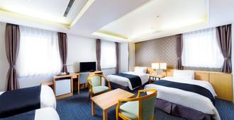 SureStay Plus Hotel by Best Western Shin-Osaka - אוסקה - חדר שינה