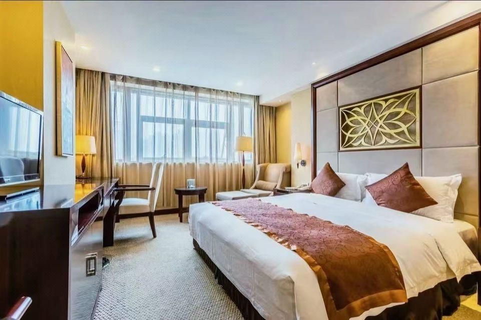 Risheng International Hotel - וושי - חדר שינה