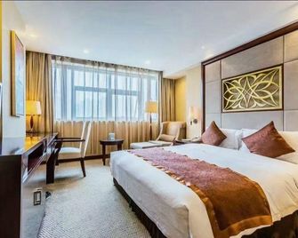 Risheng International Hotel - וושי - חדר שינה