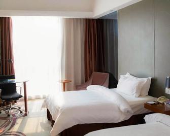 Metropolo Zhenjiang Railway Station Wanda Square - Zhenjiang - Bedroom