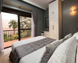 Pangolin Nest Boutique Hotel - Kampala - Bedroom