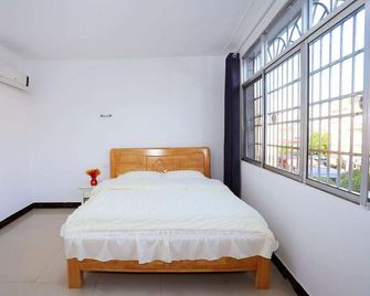 Zhangjiajie Yaran Inn - Zhangjiajie - Schlafzimmer
