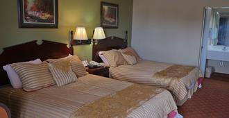 Legacy Inn & Suites - Gulfport - Makuuhuone