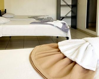 هوتل كوينتا أفينيدا - سان جوس - غرفة نوم