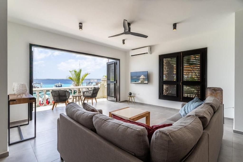 Living room view of Epic Oceanfront Apartment with Sunset and Sea View