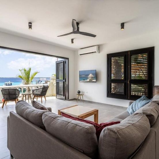 Living room view of Epic Oceanfront Apartment with Sunset and Sea View