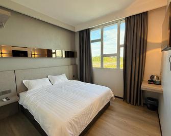 Lelian Hotel Sibujaya - Sibu - Slaapkamer