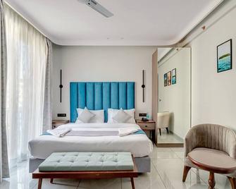 Skon Baga Bliss Hotel by Orion Hotels - Baga - Schlafzimmer