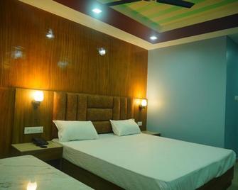 JB Hotel and Resort - Lohaghāt - Bedroom