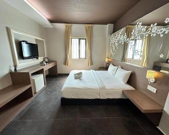 Grand Jade Ciq Hotel - ג'והור באהרו - חדר שינה