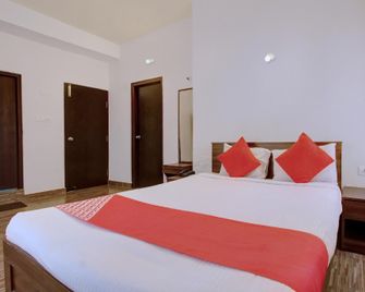 OYO Hotel Serenity Mysore - Maisur - Yatak Odası
