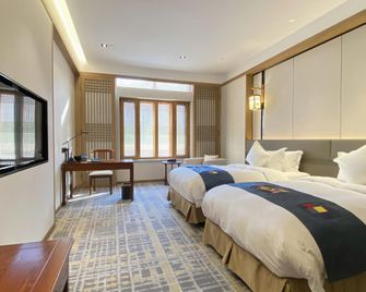 Yanbian Hotel - Yanbian - חדר שינה