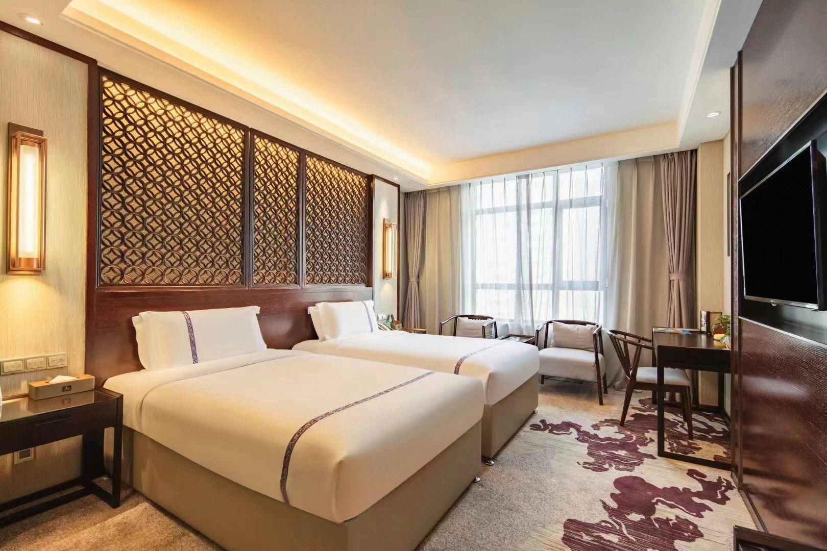 Zhaoshang Hotel - האנדן - חדר שינה